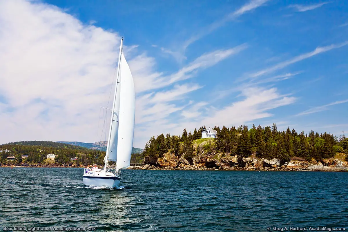 A sailboat exits Somes Sound at the southern end of Mount Desert Island in Maine.