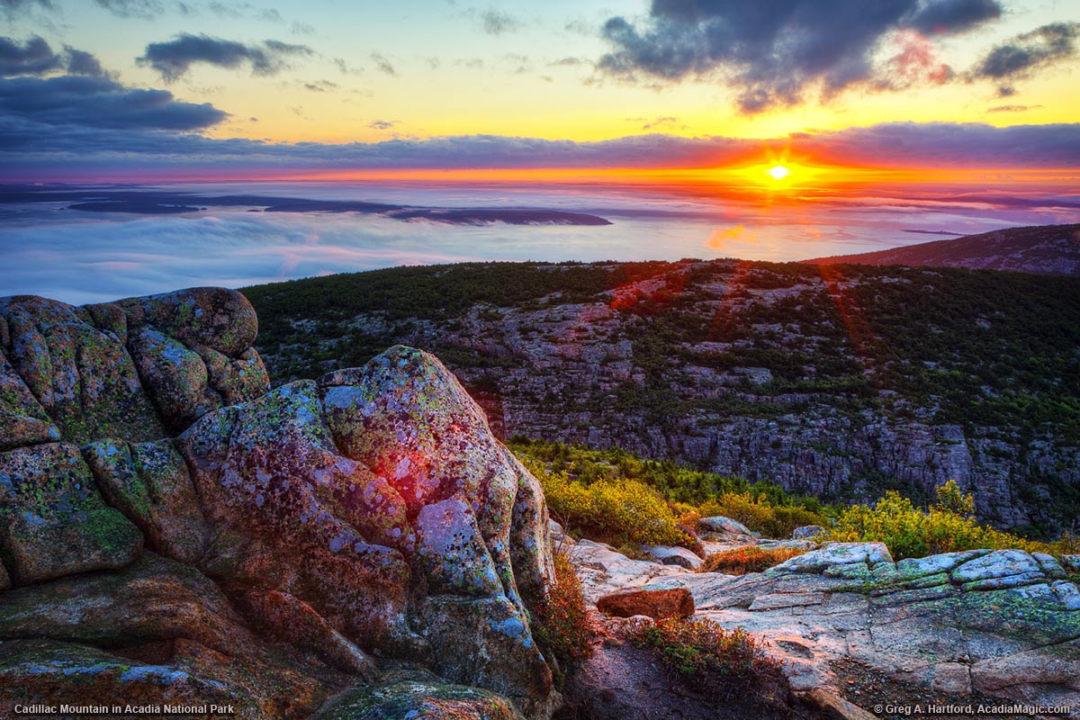 Sunrises over Dorr Mountain seen from Cadillac Mountain in Acadia