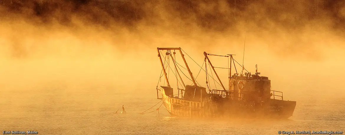 Scallop Dragger during sunrise fog in East Sullivan, Maine