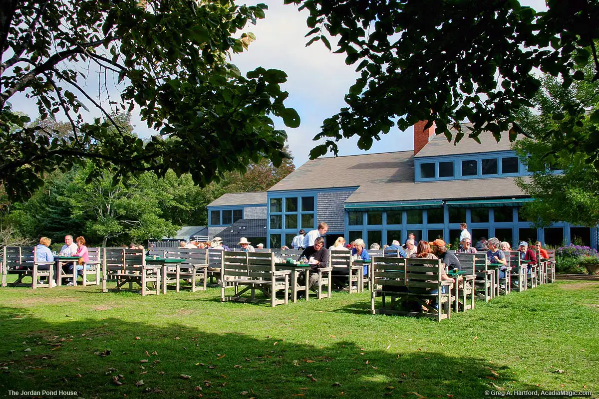 A view of people dining on lawn at the Jordan Pond House in Acadia