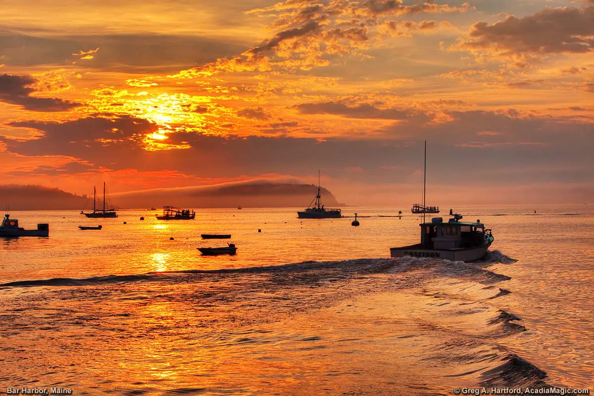 Lobster Boat leaving harbor at sunrise in Bar Harbor, Maine
