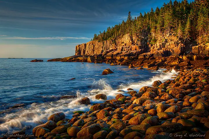 A classic view of Otter Cliff and Boulders on a calm morning