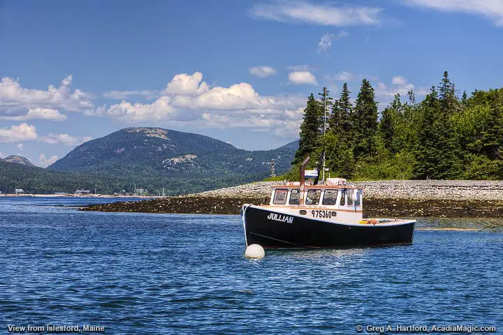 Lobster boat with Mount Desert Island in background