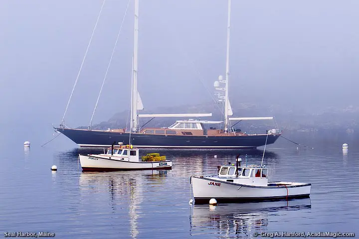 Yacht and lobster boats in harbor
